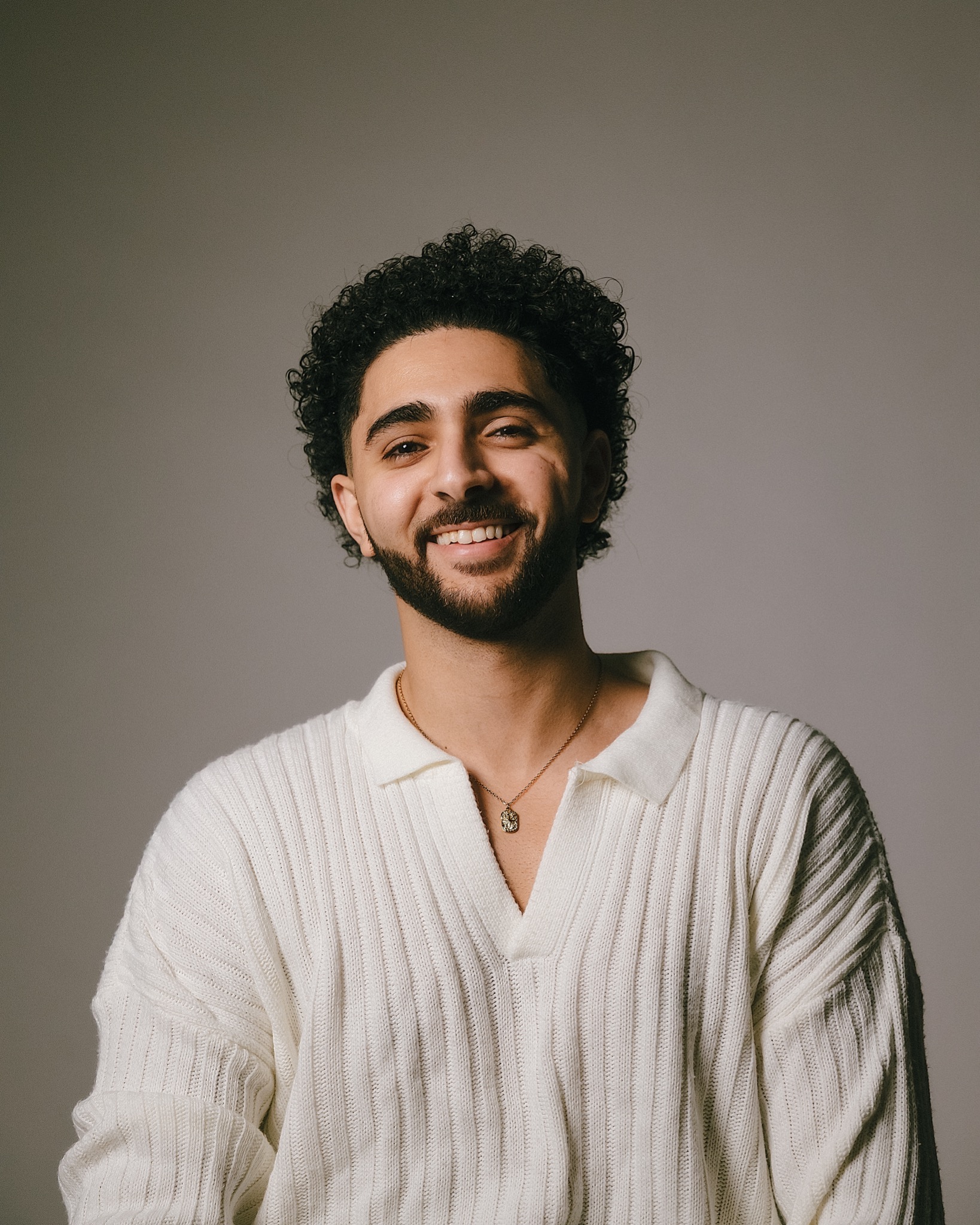 White knit smiling portrait